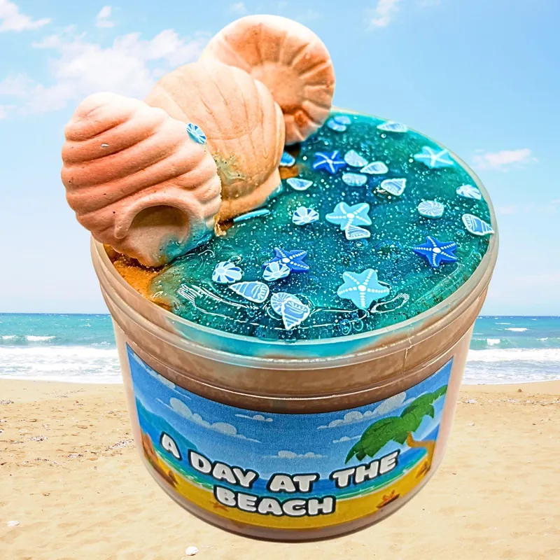 A Day at the Beach jar with sandy slime, blue clear slime and seashell toppers