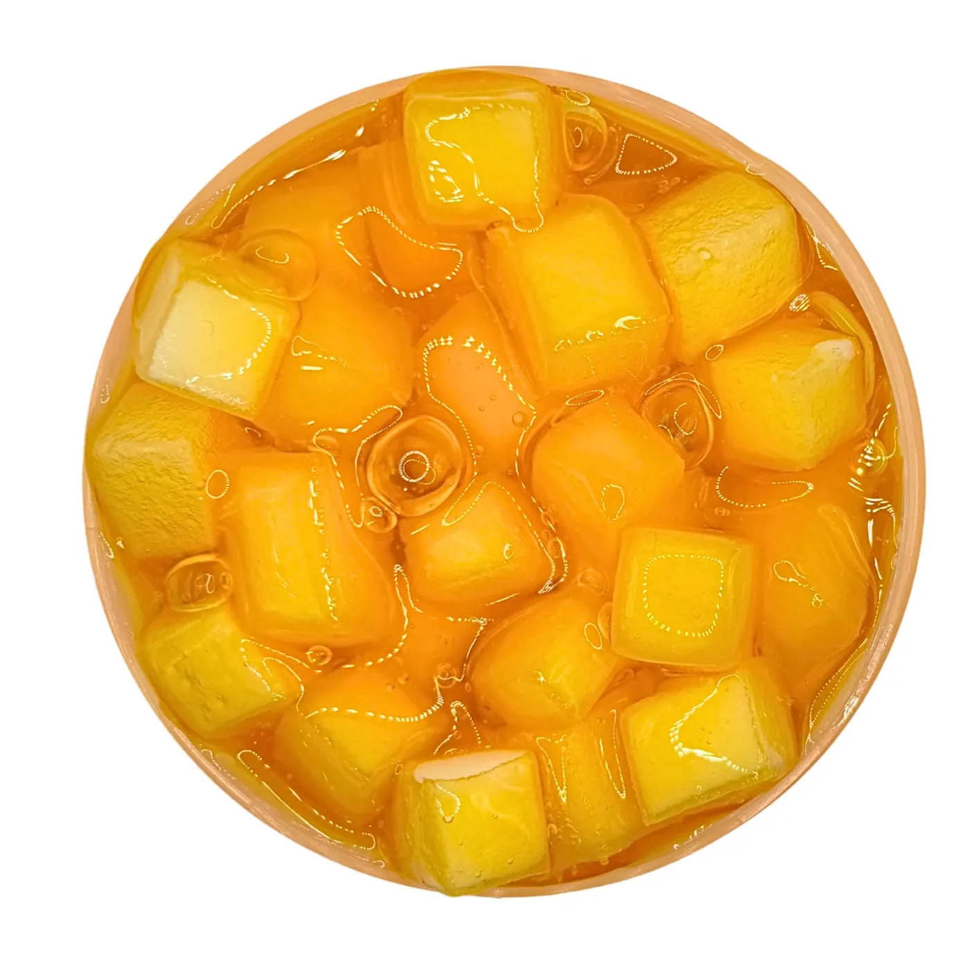 Top view of golden jelly cubes in clear slime